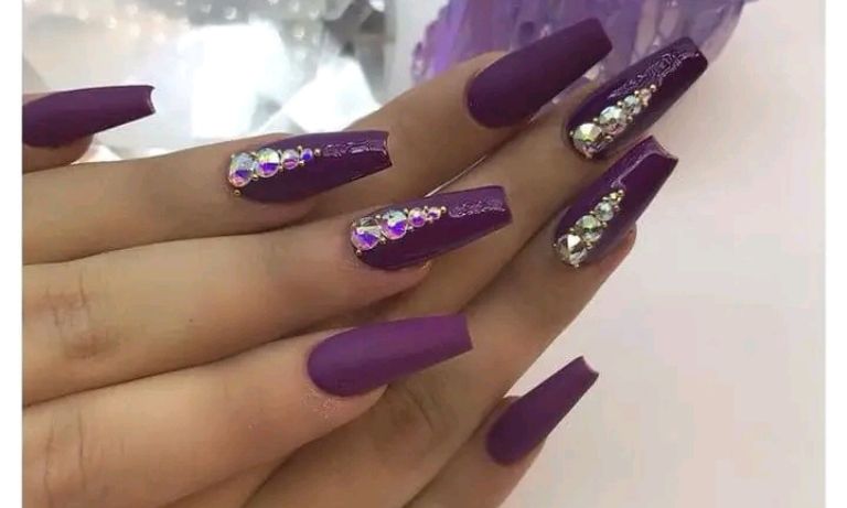 Purple nail art with stone